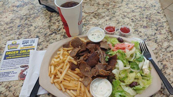 Gyros Plate w/2 Tsaziki sauces, French fries, small Greek Salad and a grilled pita.