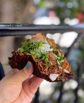 Keto Birria: Cheese shell w/ shredded beef, onions, cilantro ($4.15)