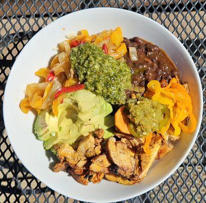 Happy Bowl loaded with adobo chicken, peppers & onions, avocado & housemade spicy mix