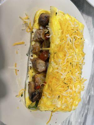 Fresh made omelet with shrimp and chicken apple sausage.