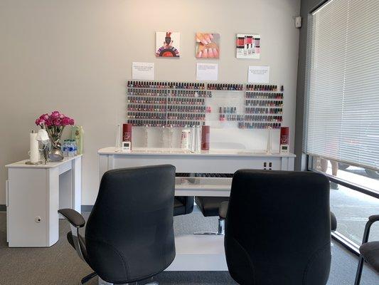 One of the manicure areas with shields, there is a long row of manicure stations as well!