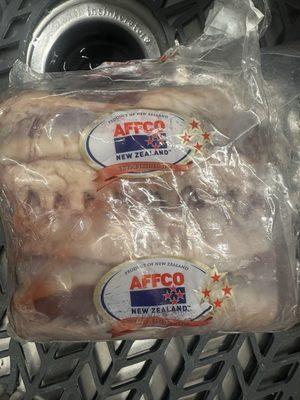 Package of frozen lamb chop racks.