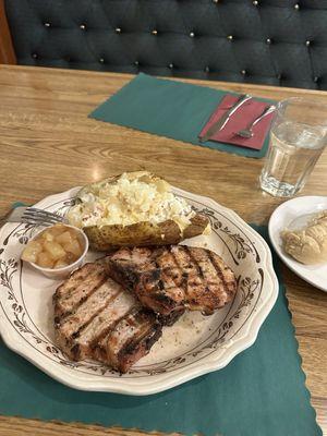 Pork chops with loaded potato.