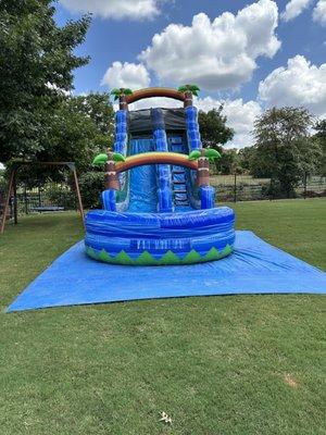 20ft tall waterslide with tarp underneath. All day rental $275.