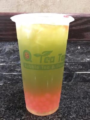 Green apple tea/juice with strawberry popping boba