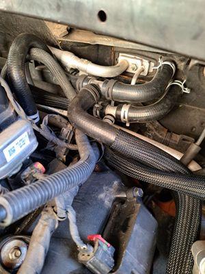 Replaced heater hoses. Plastic fittings replaced with metal. Cause of the overheat condition.