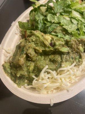 Guacamole on bowl which also had a large piece of black skin