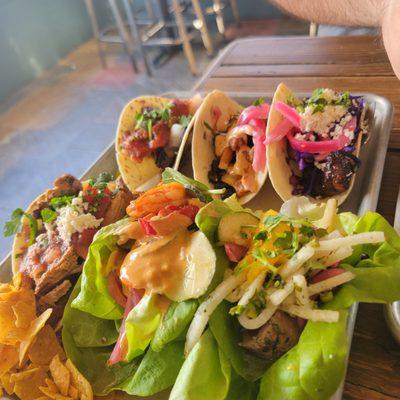 Closest row are lettuce shrimp and tuna, then flour chicken. Next row is Carne asada, chorizo, and sweet potato -- all in flour tortillas.