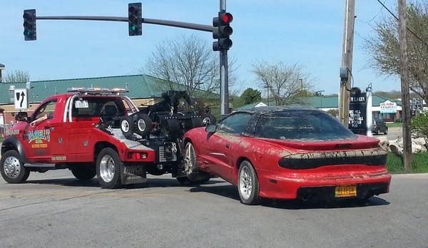 Towing my poor Firebird on its last voyage from the depths of Four Lakes