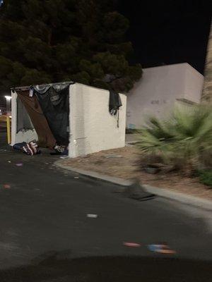 homeless camp directly behind businesses