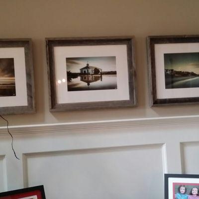 3PC grid of framed pictures mounted on drywall