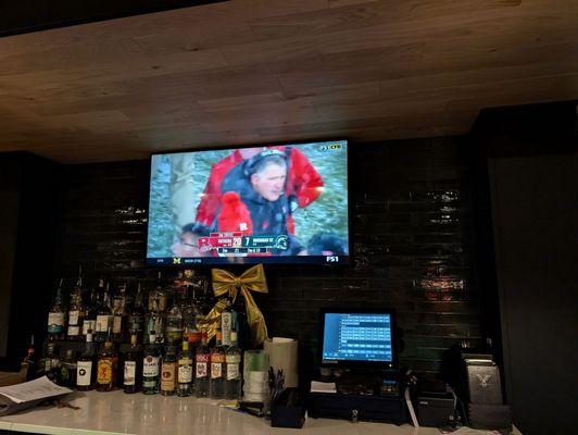 We were able to watch the game on the large TVs at the bar.