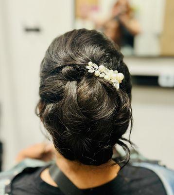 Updo style for wedding or event styling.