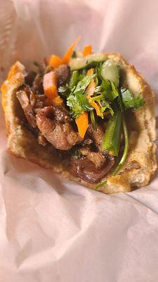 Inside view of the pork banh mi sandwich - $6