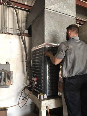 Here is a 5 ton condensing unit we installed inside a mechanic shop due to theft. We installed the proper ventilation as well.