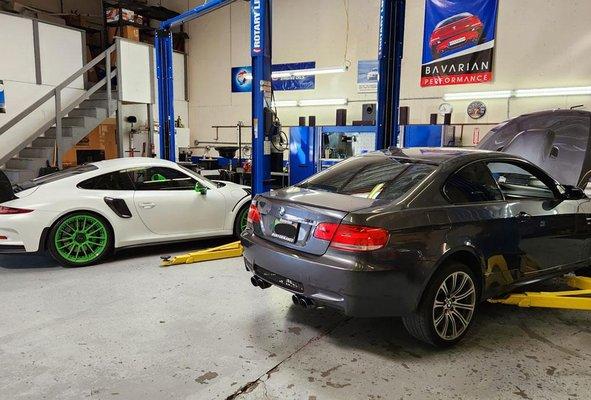 Porsche 911 GT3RS and BMW M3 in for maintenance. BMW mechanic. BMW repair