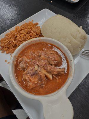 Oxtail, jollof rice, yam fufu