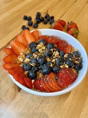 Greek yogurt, blueberries, strawberries, granola and chia seeds.