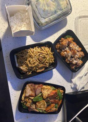 Sesame chicken, beef lo Mein, pork roast and tofu