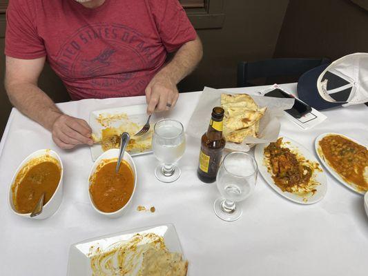 Lamb Curry, Butter Shrimp, Garlic Naan, Chili Paneer and Simosa Chaat.