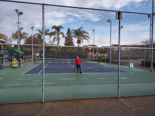 Tennis Center provides a battery powered leaf blower to dry the court after overnight rains