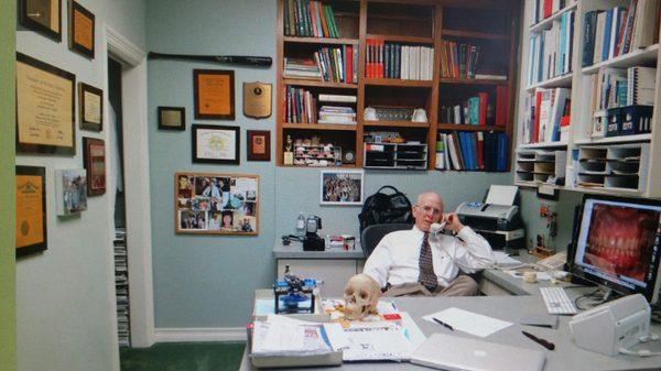 Dr Simon speaking with a patient on the phone.