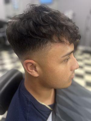 Skin fade and perm .