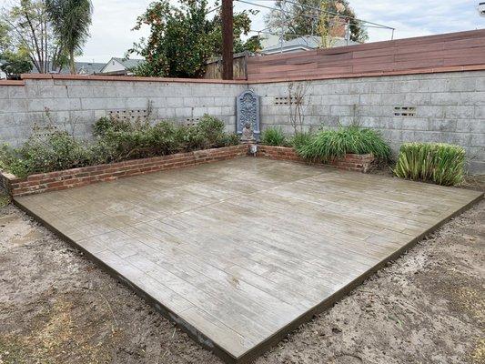 Here's the colored and stamped concrete pad for our future pergola.