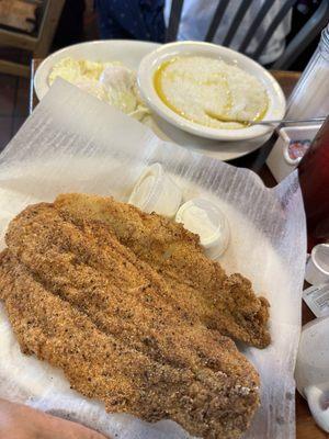 Fried fish with eggs and grits