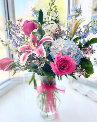 What could be better than stargazer lilies with roses and hydrangea with waxflower?