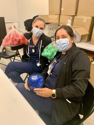 Jade and Nidya are helping us prepare swag bags for Palm Beach Pride