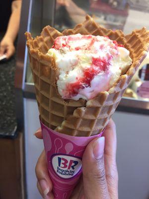 Single Scoop Strawberry Cheesecake in a Waffle Cone.