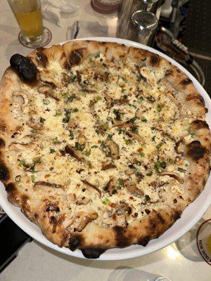 TRUFFLE MUSHROOM 27 shiitake mushrooms, goat cheese, mozzarella, kashmir chili oil, truffle honey, scallions