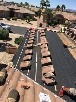 Installing new underlayment tile roof