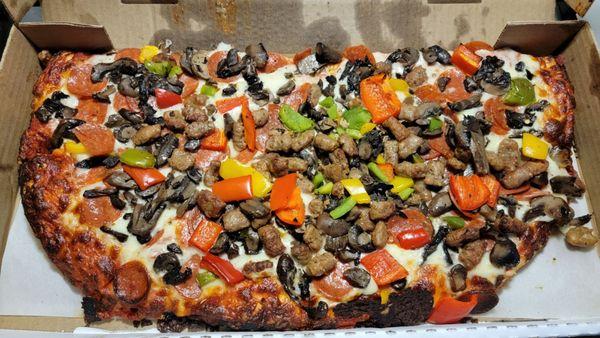 Half (9", 6 slice) Cheese, Pepperoni, Sausage, Green Pepper, and Mushroom pizza