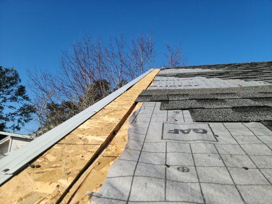 This is not how to deck a roof, big gap because the siding comes up through the roof decking