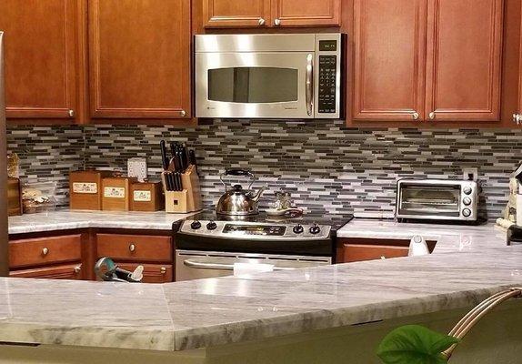 kitchen counters with tile wall