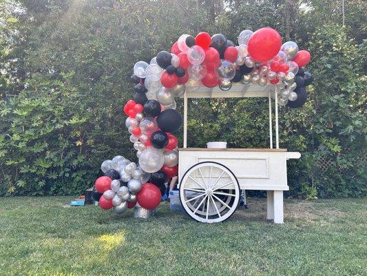 Margarita cart with a 16ft long half an organic arch.