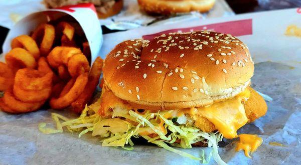 Fish sammie with curly fries.