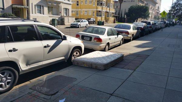 Abandoned mattress on sidewalk full of Bed Bugs.