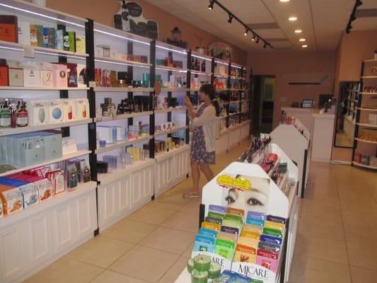 A Korean language teacher perusing the shelves of Korean skincare products at Korean Beauty.