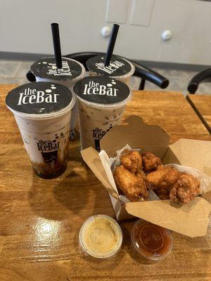 Ice bar organic milk tea with white pearl, brown sugar organic milk tea and wings recommend pick mango sauce.