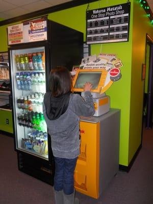 Use are Kodak Kiosk while waiting. As little as 32 cents