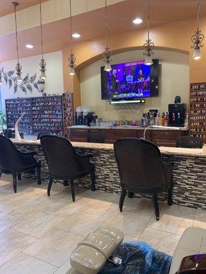 A nail salon with a bar.... hmmm