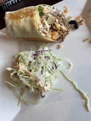 Half a chicken burrito with fresh cabbage