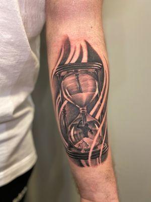 Black and grey hourglass tattoo by Stephen Lambert