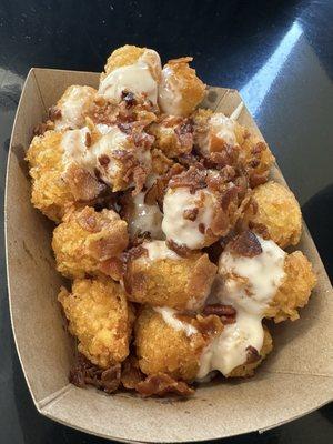 Tater Tots with queso and bacon