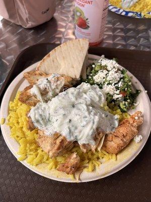 Chicken plate with yellow rice, tabouli, pita bread and tzatziki