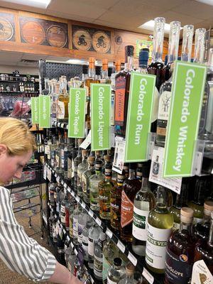 Yours truly picking out a Colorado gin in their "local aisle"