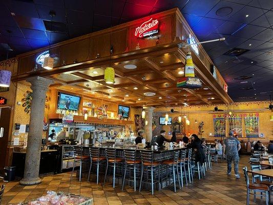 View of the bar in the middle of the dining area.